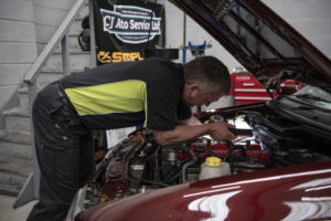 Fixing Old Maroon Ford as part of Servicing